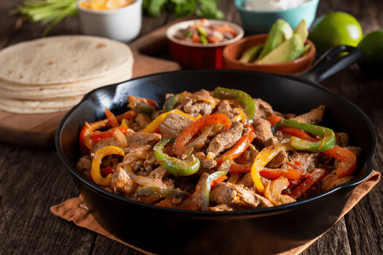 Instant Pot Chicken Fajitas: A colorful dish with tender chicken, vibrant peppers, and onions, perfect for a Tex-Mex feast at home.
