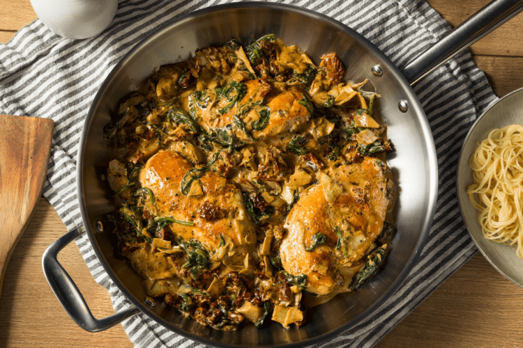 Instant Pot Tuscan Chicken: A creamy, herb-infused delight over al dente pasta – a burst of Italian flavors on a plate.